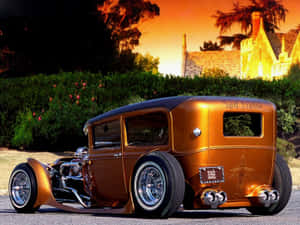 定制青銅色hot rod，帶有鍍鉻裝飾，停在夕陽下靠近石屋。