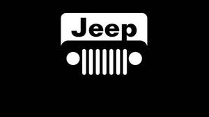 白色Jeep標誌在黑色背景上，帶有七槽格柵設計。