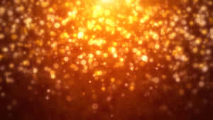 金色散景燈光在溫暖的抽象光芒中閃爍。 — 橙色美學 壁紙