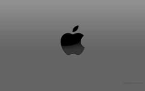 黑色Apple標誌在灰色漸變背景上帶有反射