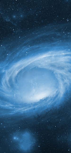一個充滿星星和發光宇宙雲的旋轉藍色螺旋星系。