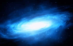 一個在深空中充滿星星的發光藍色螺旋星系。 — 美學 壁紙