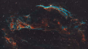 在無數恆星中閃耀的充滿活力的青綠色和橙色星雲。 — 太空美學 GIF 壁紙
