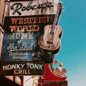 晴朗藍天下，帶有結他和牛仔主題的復古 honky tonk 標誌。