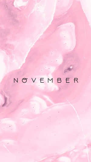粉紅色和白色大理石紋理，帶有黑色文字的「november」。