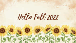 向日葵和文字 Hello Fall 2022 在帶紋理的背景上。