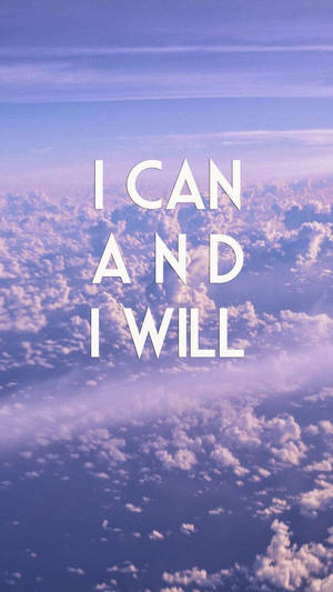 勵志文字「I CAN AND I WILL」在紫色和藍色的多雲天空上。