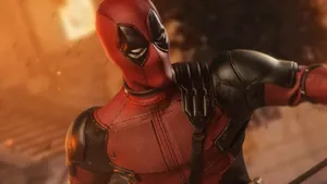 死侍身穿紅黑戰衣,在熾熱爆炸中擺出戰鬥姿勢。