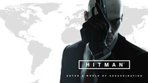 Hitman 刺客手持手槍對準太陽穴，背景是世界地圖。 — 殺手 壁紙