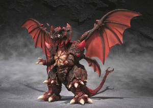 在黑暗煙霧環境中展開翅膀的紅黑龍玩具雕像。 — 哥斯拉 王者巨獸 壁紙
