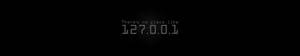 黑色背景上發光的數位文字顯示「There's no place like 127.0.1」