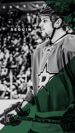 冰球運動員 Tyler Seguin 身穿達拉斯星隊制服，在冰上手持球棍。 — Tyler the creator GIF 壁紙