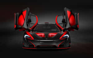黑色和紅色McLaren超級跑車，在黑暗的工作室中打開鷗翼車門。