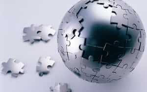 銀色拼圖碎片形成一個地球儀，附近有零散的碎片。