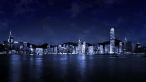 香港夜景，發光的建築物倒映在水中。 — 夜晚 GIF 壁紙