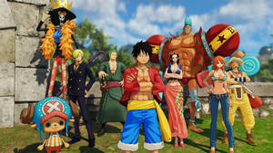 《One Piece》動漫團隊在陽光明媚的天空下於戶外草地上擺姿勢。