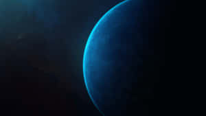 一顆藍色行星在黑暗星空背景下的剪影。 — 簡約藍色美學 壁紙