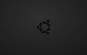 Ubuntu 標誌壓印在深色紋理背景上。