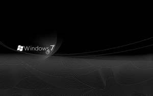 黑色背景上的 Windows 7 標誌，帶有白色線條藝術。