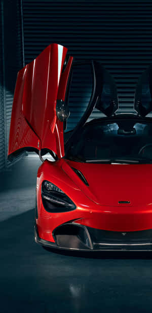在黑暗車庫中打開剪刀門的紅色McLaren跑車。 — 肖像 壁紙