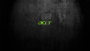 在深色紋理牆上以綠色照亮的 Acer 標誌。