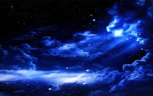 充滿活力的夜空，帶有發光的藍色雲朵和閃爍的星星。 — 深藍色 壁紙