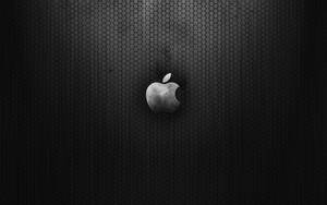 深色六角網格背景上的Apple標誌