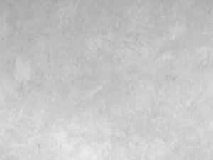 光滑淺灰色紋理牆壁，帶有細微斑駁圖案。 — 純灰色 壁紙