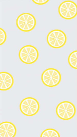 淺灰色背景上重複排列的黃色檸檬片圖案。