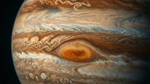 木星，帶有漩渦的橙色、棕色和白色雲層，大紅斑可見。