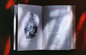 打開的復古書籍，插圖為女士在湖上小船，發光紅色背景。