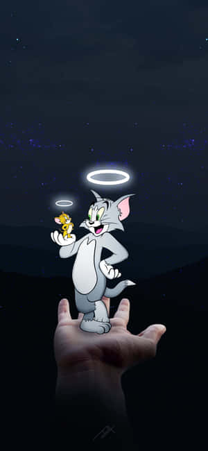 湯姆和傑瑞化身天使，在繁星點點的夜空背景下漂浮在手掌上方。