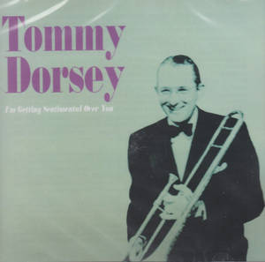 Tommy Dorsey 身穿燕尾服，在復古專輯封面上手持長號。 — 猶他爵士 壁紙