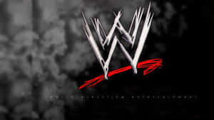 在深色煙霧背景上的銀色和紅色 WWE 標誌 — 電腦 GIF 壁紙