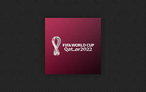 FIFA World Cup Qatar 2022 官方標誌在洋紅色背景上。