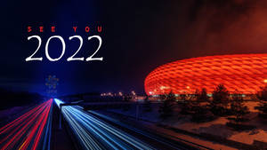 安聯球場夜景，紅燈和劃過的車流，下方有「SEE YOU 2022」文字。