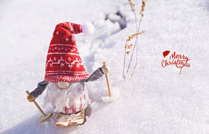 節日聖誕老人在雪地冬季風景中滑雪，附有聖誕祝福。