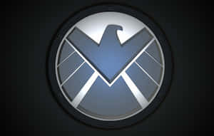 S.H.I.E.L.D.標誌帶鷹徽章在深色背景中發光 — 復仇者聯盟標誌 壁紙