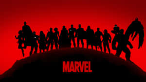 Marvel 超級英雄團隊剪影在山丘上，背景是紅色天空。 — 復仇者聯盟 壁紙