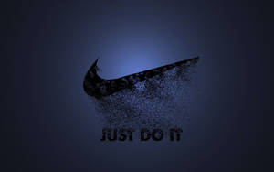 Nike剔勾標誌分解成粒子，並帶有「JUST DO IT」文字。