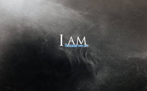 文字 I AM Because we are 在黑暗旋轉的煙霧中發光。