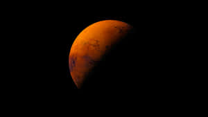 火星在太空中發出橙色光芒，表面細節可見。 — 火星 GIF 壁紙