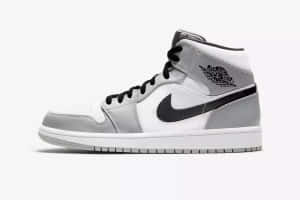 灰黑色高筒運動鞋，帶有Nike勾勾和Air Jordan標誌。