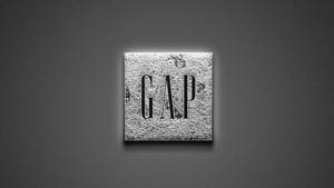 深色穿孔背景上的金屬GAP標誌 — 2560x1440 壁紙