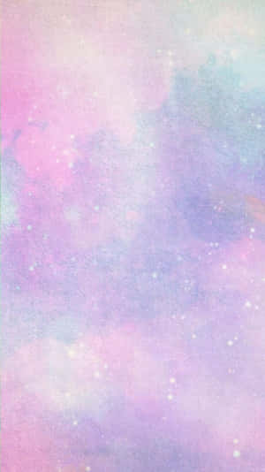 柔和雲朵同閃爍星星嘅粉彩星系。 — 糖果 GIF 壁紙