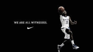 身穿肯塔基球衣的籃球運動員在半空中持球，附有Nike標語 — 4K籃球壁紙