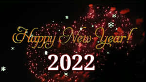 黑色背景上帶有紅色煙火和雪花的2022新年快樂文字