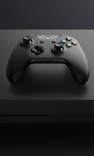 黑色Xbox控制器在深色表面上，柔和燈光