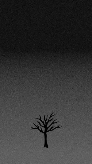 一棵孤獨的光禿樹木剪影，背景為帶紋理的灰色漸變天空。 — 綠樹 壁紙