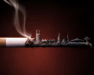 一支香煙，灰燼形成城市天際線形狀，並有升起的煙霧。 — 抽象藝術 壁紙